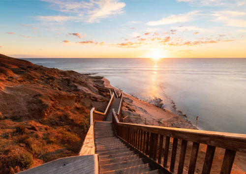 Golden sunset over the Port Noarlunga coastal boardwalk in South Australia