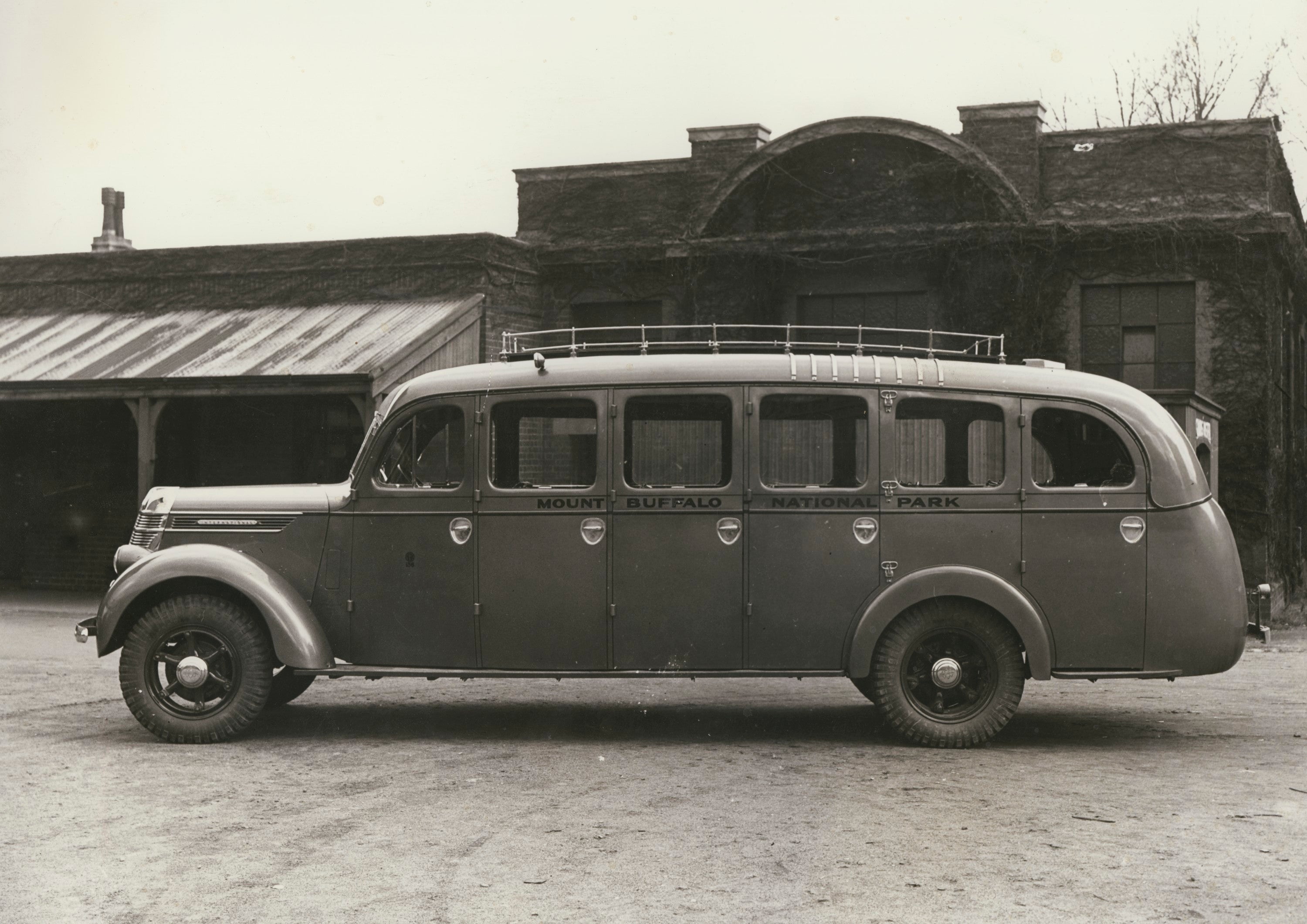 Black-and-white photograph of a vintage Mount Buffalo National Park motor coach from around 1930